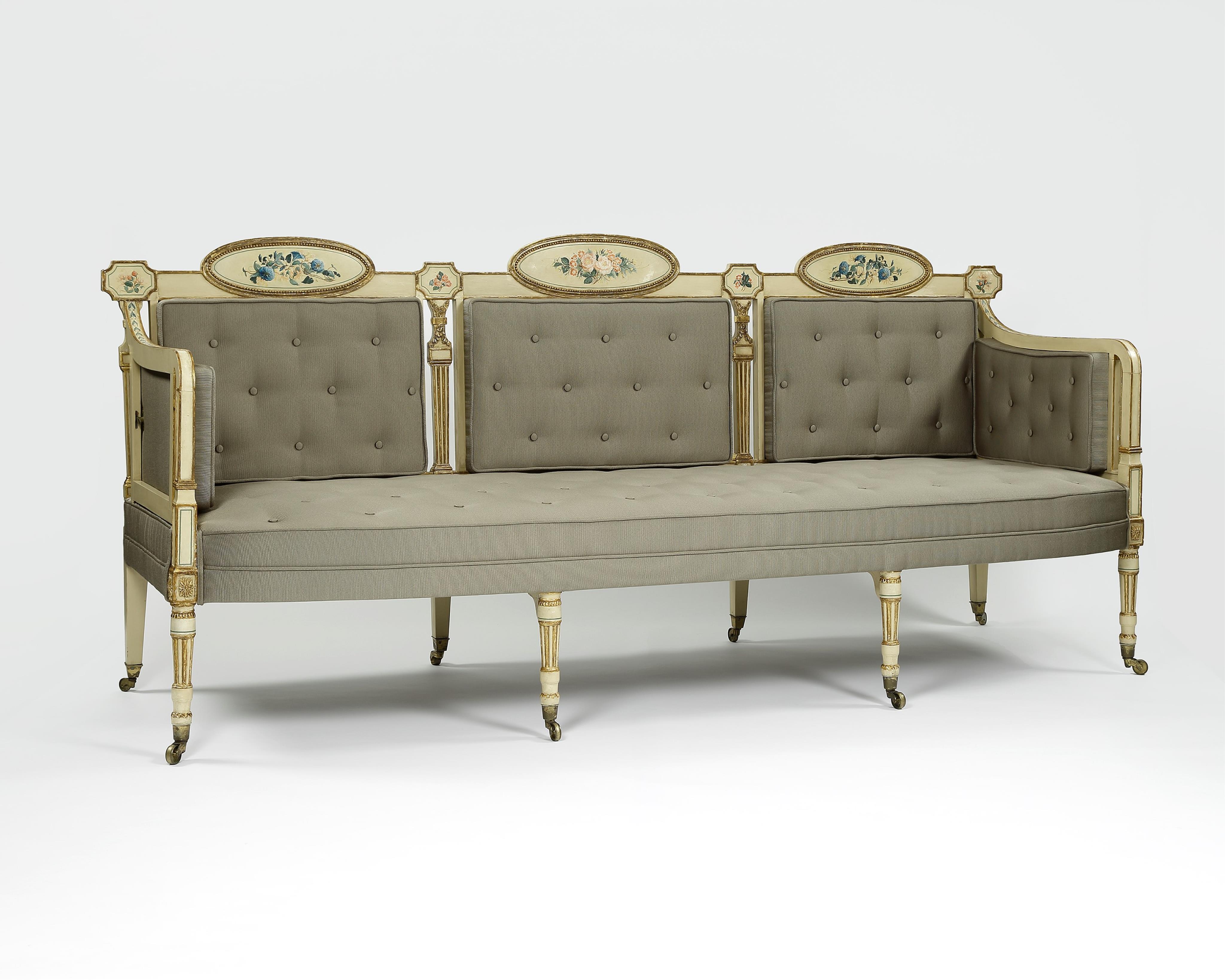 A pair of George III cream painted and parcel gilt settees, in the manner of George Brookshaw (1751-1823)